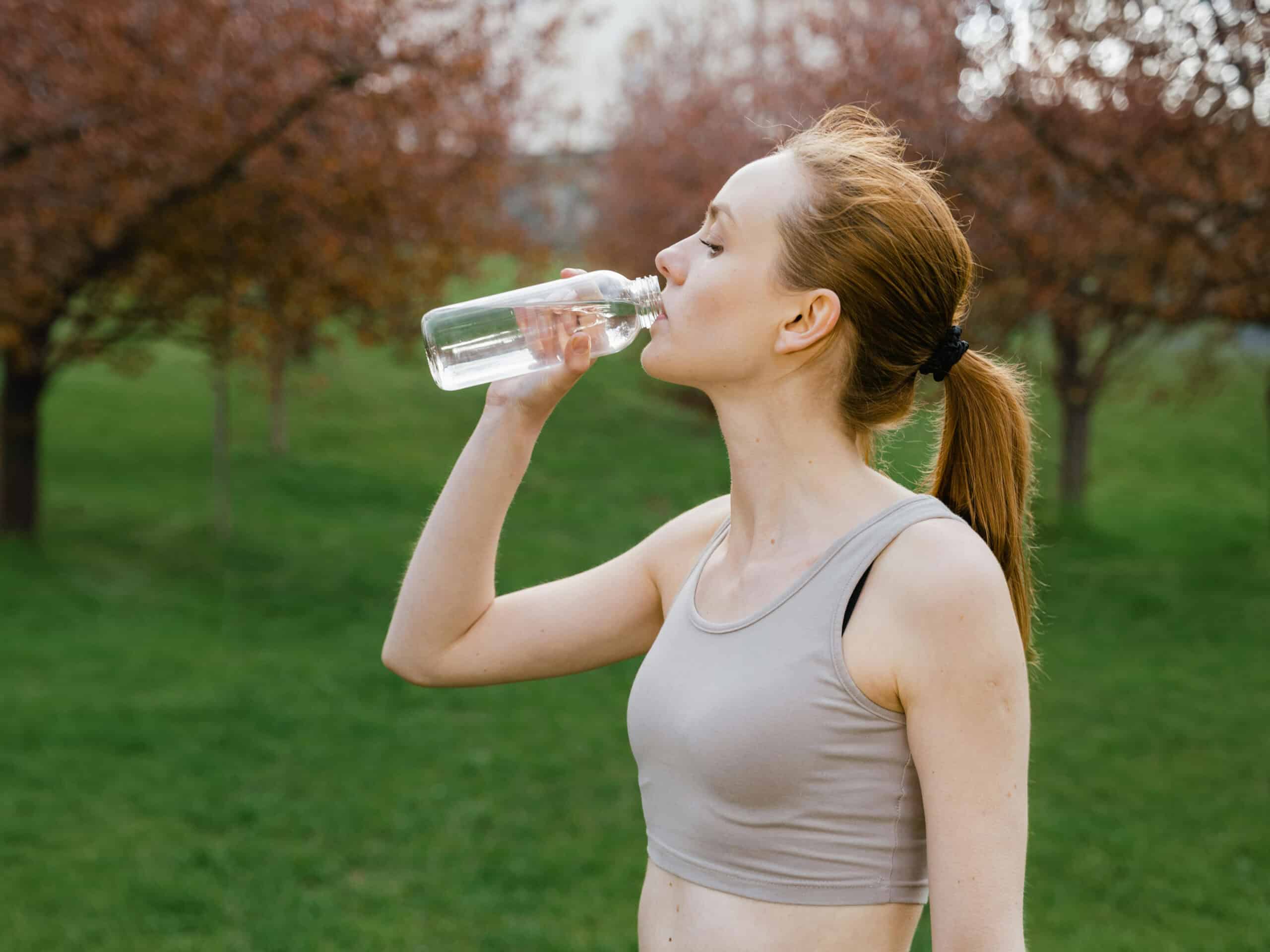 Photo by MART PRODUCTION from Pexels: https://www.pexels.com/photo/woman-in-activewear-drinking-a-bottle-of-water-7880192/